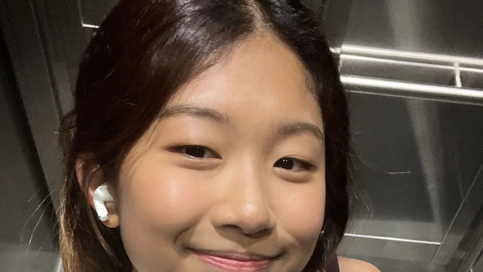 Angela smiling into the camera
